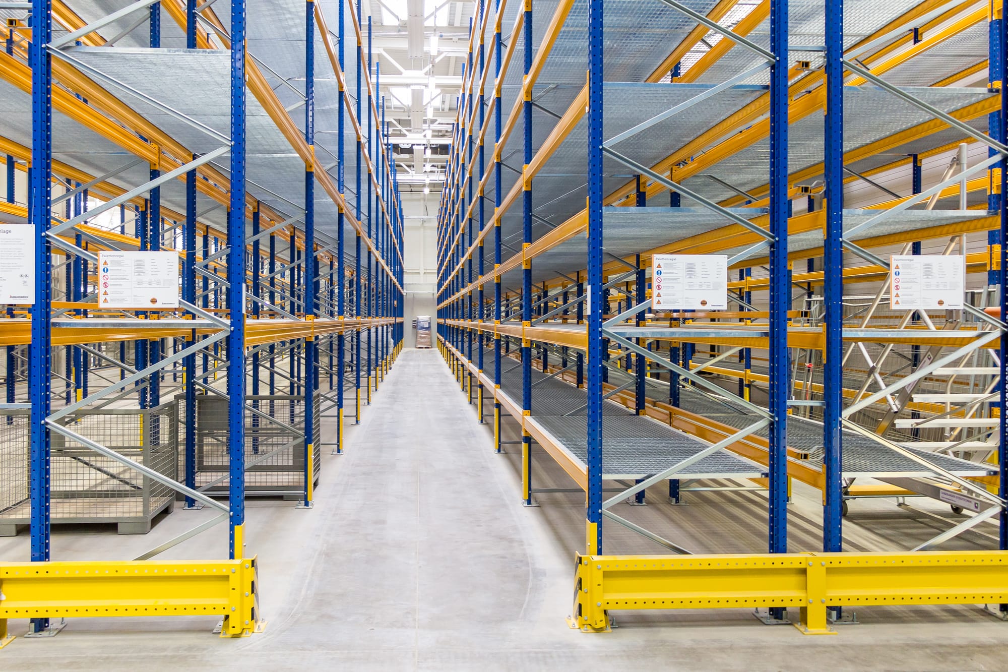 Long aisle of empty pallet racking in a new warehouse